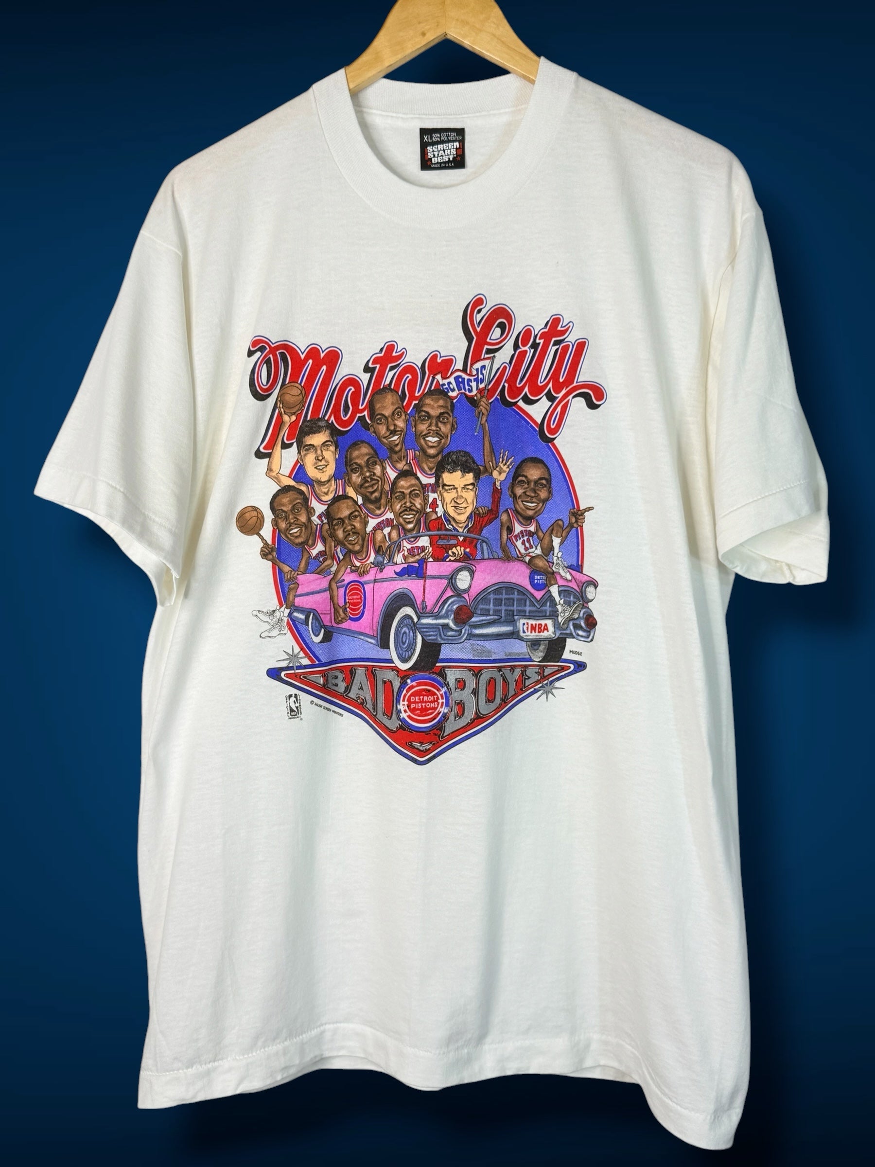 Brass Monkey Vintage white t-shirt featuring a retro Detroit Pistons Bad Boys graphic with players in a convertible.
